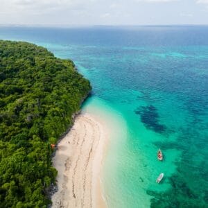 AerialViewOfTropicalIslandCoastWithWhiteSandBeach