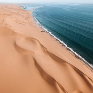 AerialDroneWhereDesertMeetsTheOceanSandwichHarbourNamibia