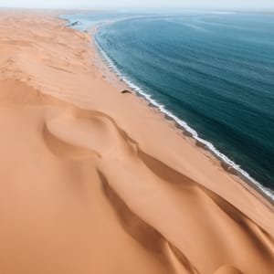 AerialDroneWhereDesertMeetsTheOceanSandwichHarbourNamibia